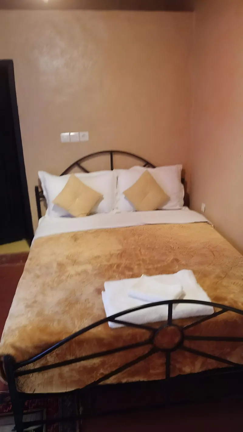 Double or Twin Room: the bed with white linen